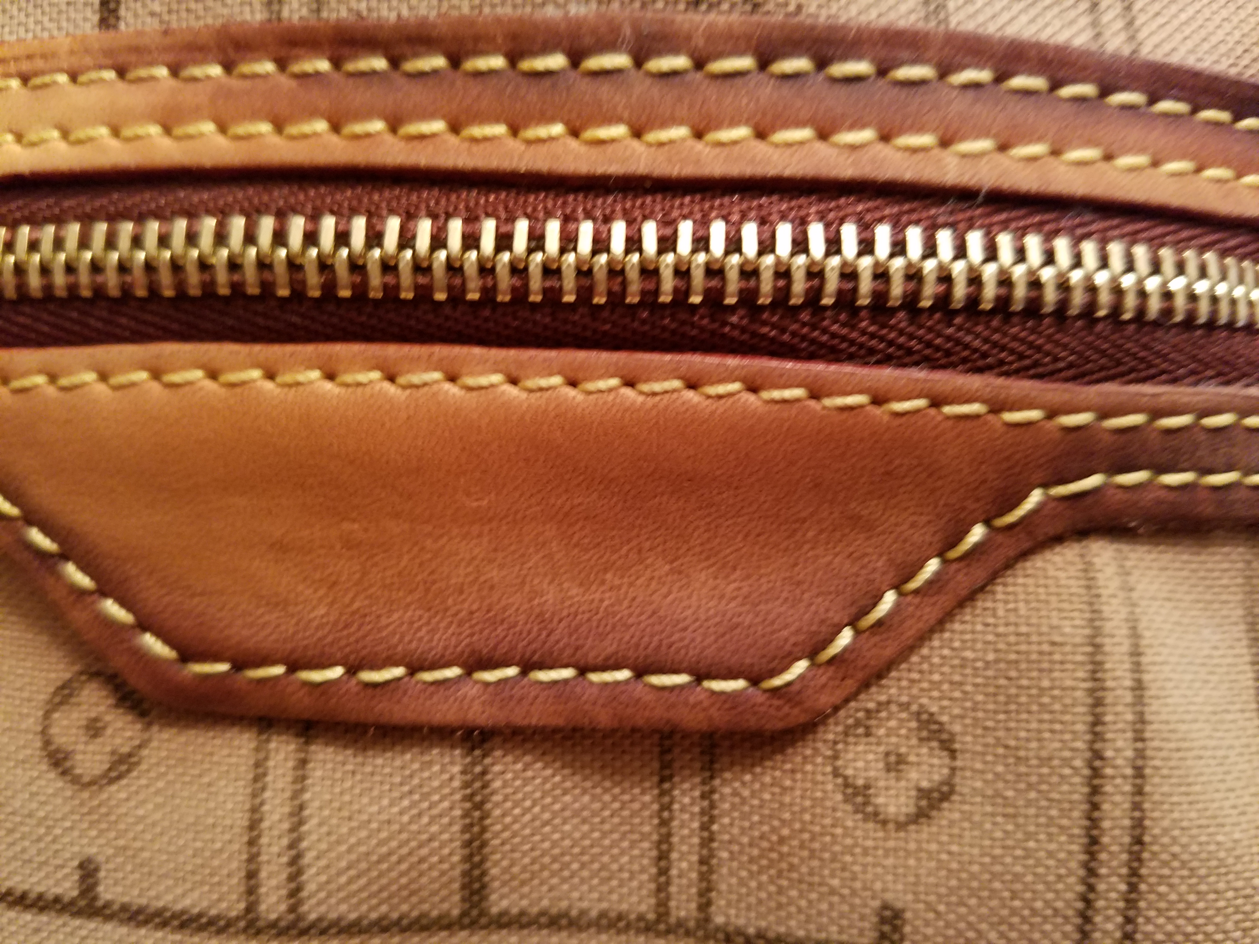 Inside pocket of neverfull ruined by wet towel with vinegar