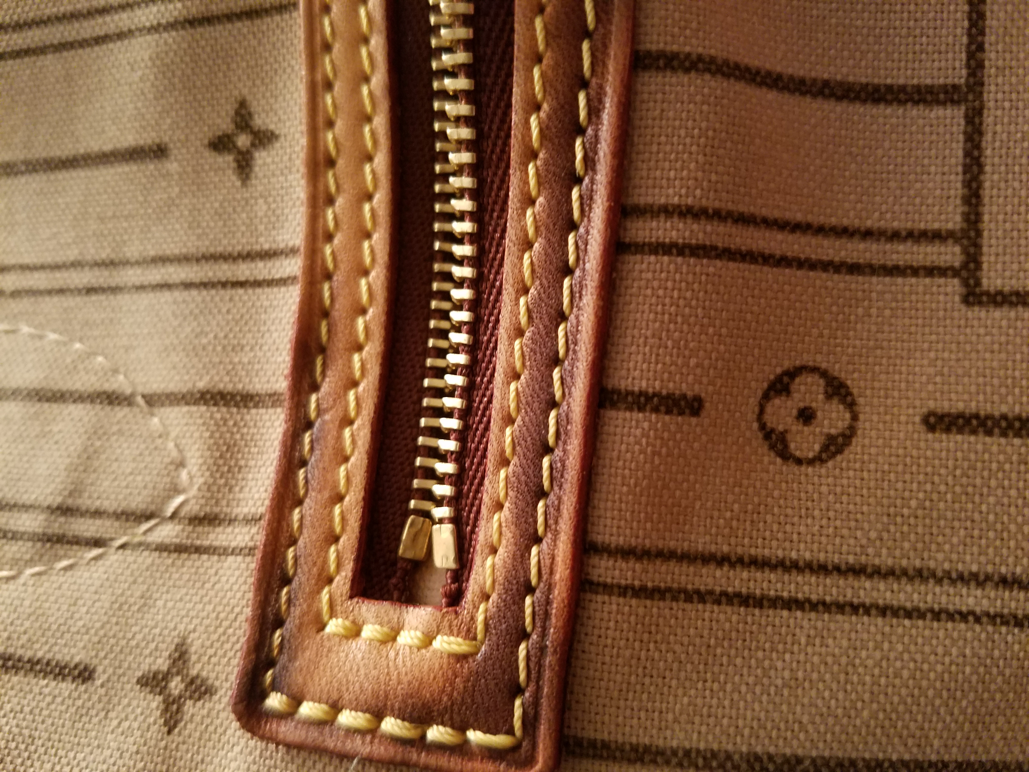 Inside pocket of neverfull ruined by wet towel with vinegar