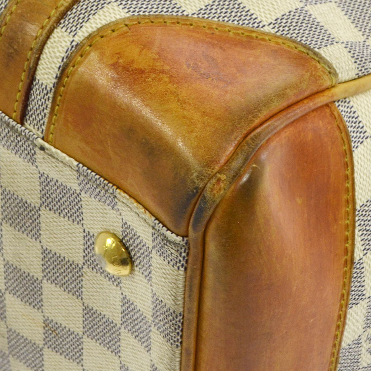 Louis Vuitton Vachetta leather trim -nhow to fix the little tear?